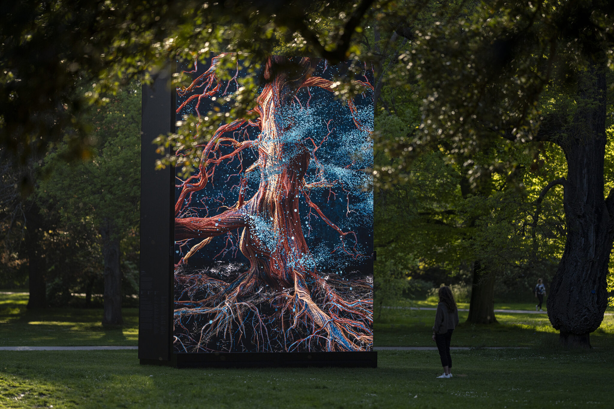 Of the Oak, an illuminated digital tree artwork installed among trees at Kew Gardens.